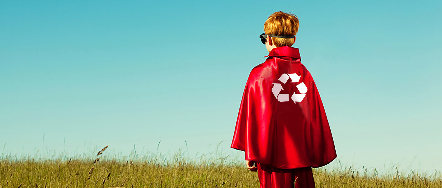 young boy in a red super hero cape recycle logo